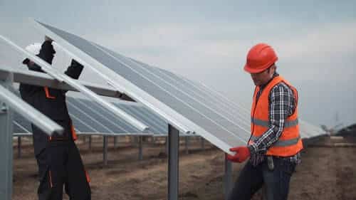 Solar PV Workers Install Solar Farm Panels